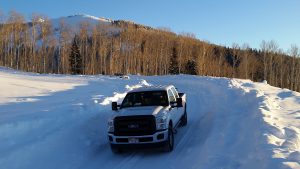 truck in deep snow on the geyser pass road la sal mountains utah